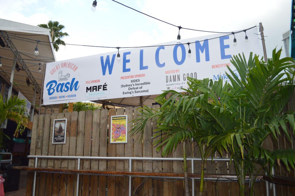 A big sign of welcome hung above the wooden wall